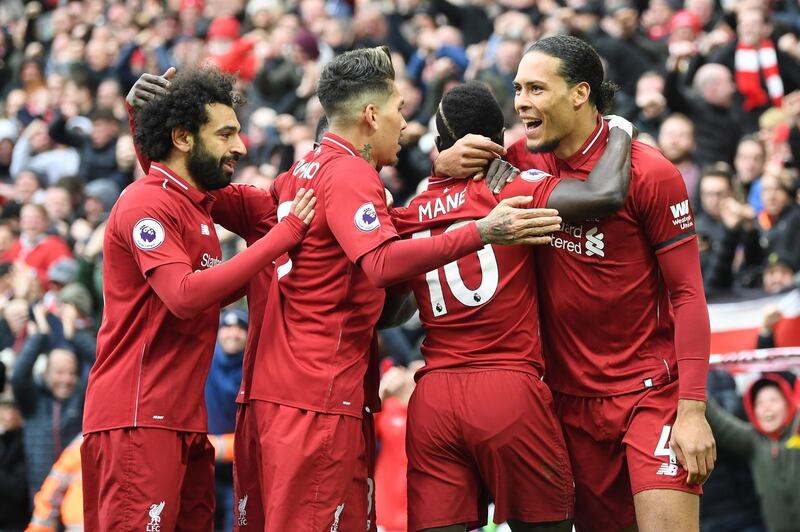 LIVERPOOL, ENGLAND - APRIL 14:  Sadio Mane of Liverpool (10) celebrates after scoring his team's first goal with Virgil van Dijk, Roberto Firmino and Mohamed Salah during the Premier League match between Liverpool FC and Chelsea FC at Anfield on April 14, 2019 in Liverpool, United Kingdom. (Photo by Michael Regan/Getty Images)