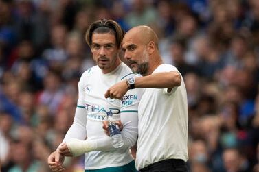 LONDON, ENGLAND - AUGUST 07: Manchester City Manager Pep Guardiola talks to Jack Grealish before his debut for Manchester City during the The FA Community Shield between Manchester City and Leicester City at Wembley Stadium on August 07, 2021 in London, England. (Photo by Visionhaus / Getty Images)