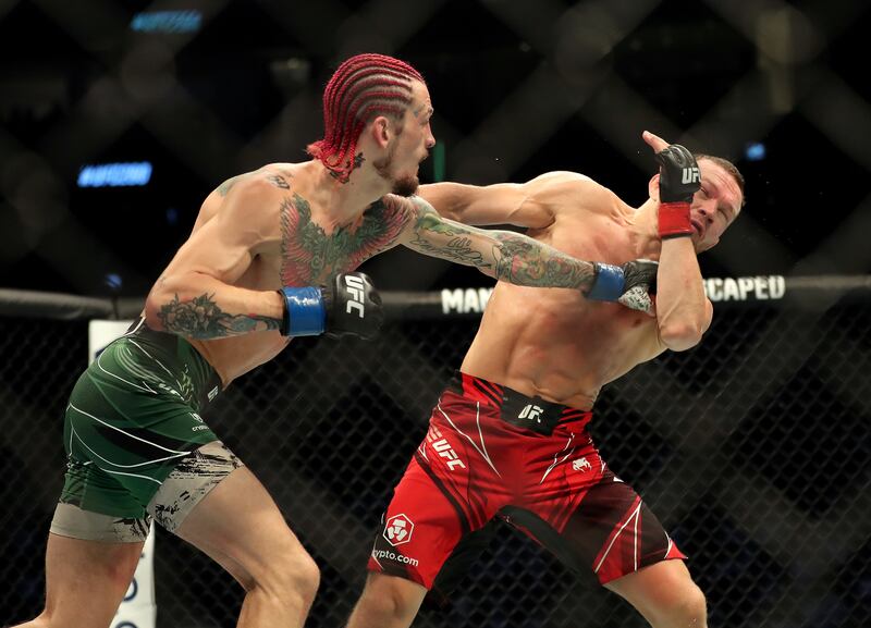 Sean O'Malley punches Petr Yan in their bantamweight bout. Chris Whiteoak / The National