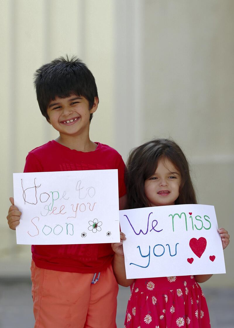 Dubai, United Arab Emirates - Reporter: N/A. Photo Project. Missing our teachers. Kamran and Areesa Blakey, aged 6 and 3 from the UK and their teachers are Miss Corkhill and Miss Mishka at Arcadia preparatory School and Paddington Nursery. "We miss you and hope to see you soon". Monday, June 8th, 2020. Dubai. Chris Whiteoak / The National