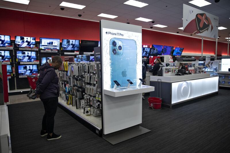 A shopper browses an Apple Inc. iPhone display at a Target Corp. store in Chicago, Illinois, U.S., on Saturday, Nov. 16, 2019. Target Corp. is scheduled to release earnings figures on November 20. Photographer: Daniel Acker/Bloomberg