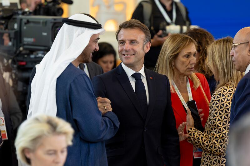 Sheikh Mohamed with Mr Macron. Photo: Ryan Carter / UAE Presidential Court