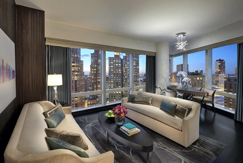 <p>Living room of a suite with views of the Hudson River at Mandarin Oriental, New York</p>
