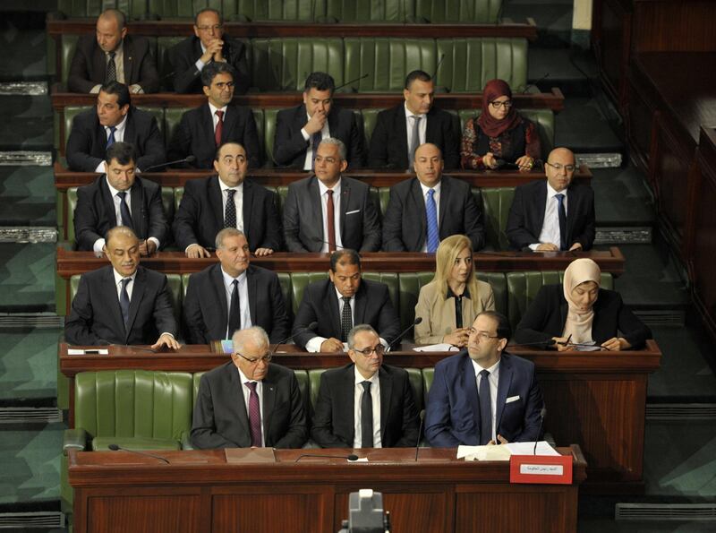 epa07160972 Tunisian Prime Minister Youssef Chahed (R, bottom) attends with new ministers a session of the House of People's Representatives (HPR) dedicated to the vote of confidence on the new government members, in Tunis, Tunisia, 12 November 2018. Tunisian lawmakers held a session to decide on the new government members proposed by Prime Minister Youssef Chahed on 05 November in a cabinet reshuffle.  EPA/STRINGER