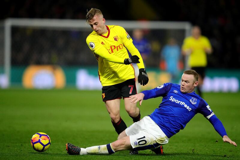 WATFORD, ENGLAND - FEBRUARY 24:  Wayne Rooney of Everton tackles Gerard Deulofeu of Watford during the Premier League match between Watford and Everton at Vicarage Road on February 24, 2018 in Watford, England.  (Photo by Chris Brunskill/Getty Images)