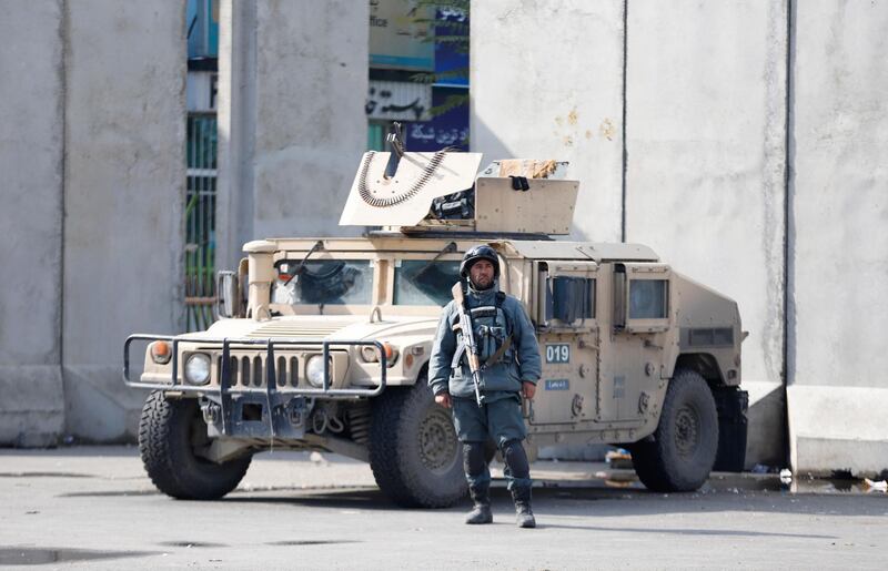 epa07160844 An Afghan soldier stands guard near to a demonstration outside the presidential palace in Kabul, Afghanistan, 12 November 2018.  During a gathering hundreds of protestors shout slogans against Taliban and the so-called Islamic State (IS or ISIS) asking Afghan President Ashraf Ghani to take action against the militant groups. The Taliban have recently launched attacks on some of the districts of Ghazni, Uruzgan and Daikundi provinces in which many civilians and soldiers were killed and dozens of other were injured.  EPA/JAWAD JALALI