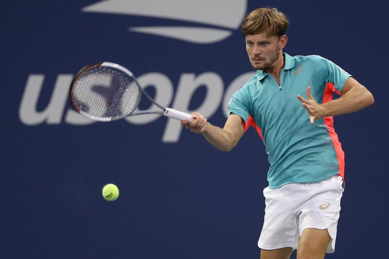 David Goffin of Belgium returns a shot during his Men's Singles first round match against Reilly Opelka of the United States. AFP