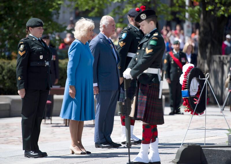 Prince Charles and Camilla, Duchess of Cornwall participate in a wreath laying ceremony at the National War Memorial in Ottawa, while on their Canadian Royal tour, Wednesday May 18, 2022. The Canadian Press/AP