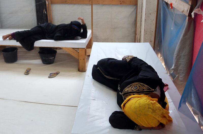 Yemeni women suspected of cholera are treated at a hospital in the Yemeni coastal city of Hodeida on October 1, 2018. The war between Yemen's government, backed by a Saudi-led regional military coalition, and Huthi rebels linked to Iran has left an estimated 10,000 dead since 2015 and triggered what the UN calls the world's worst humanitarian crisis. Another 2,200 have died of cholera, according to the World Health Organization, nearly one-third of them under the age of five. 
 / AFP / ABDO HYDER

