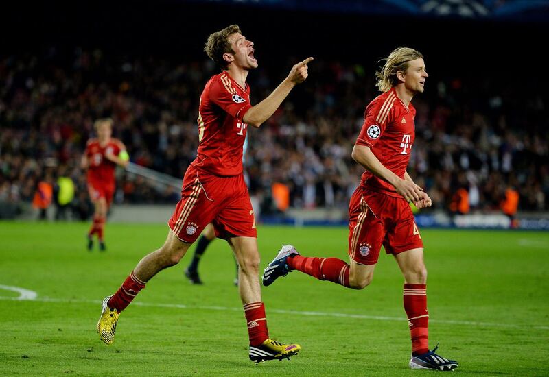 BARCELONA, SPAIN - MAY 01:  Thomas Muller (L) of Munich celebrates with teammate Anatoliy Tymoshchuk after scoring his team's third goal during the UEFA Champions League semi final second leg match between Barcelona and FC Bayern Muenchen at Nou Camp on May 1, 2013 in Barcelona, Spain.  (Photo by Lars Baron/Bongarts/Getty Images)