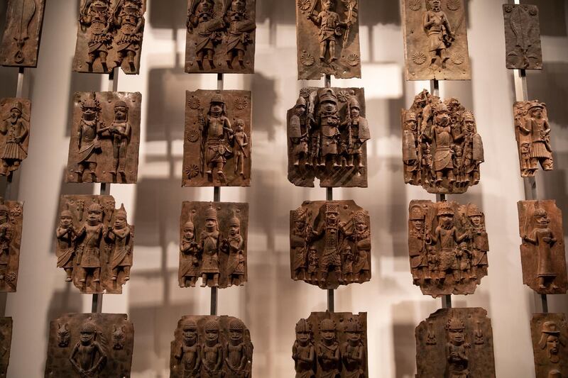 LONDON, ENGLAND - NOVEMBER 22: Plaques that form part of the Benin Bronzes are displayed at The British Museum on November 22, 2018 in London, England. The British Museum has agreed to loan the plaques back to a new museum in Benin City in Nigeria. The Benin Bronzes were taken from Africa by British troops in 1897. The return of a basalt Easter Island Head figure has also been requested this week by The Governor of the Easter Islands, Tarita AlarcÃ³n Rapu amid a broader call for artefacts taken during colonial rule to be restituted. (Photo by Dan Kitwood/Getty Images)