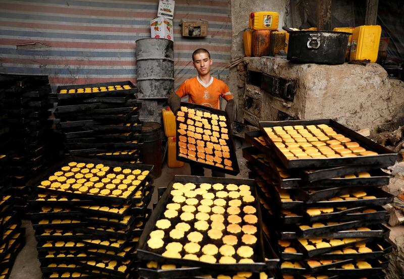 A man prepares cookies at a small traditional factory, on the first day of the holy month of Ramadan in Kabul, Afghanistan. Reuters