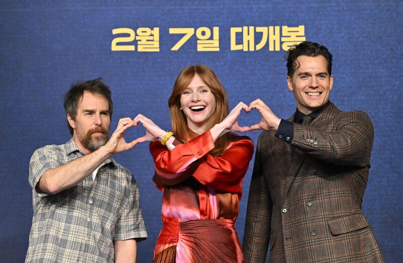 From left, US actors Sam Rockwell and Bryce Dallas Howard with British actor Henry Cavill during a press conference to promote their film 'Argylle' in Seoul. AFP