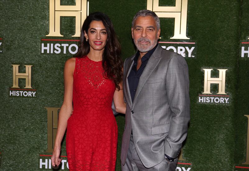 Human rights lawyer Amal Clooney and actor husband George Clooney arrive at HistoryTalks in Washington. 
