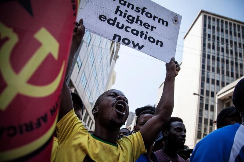 A man holds a placard and chants slogans as he takes parts with students and members of the South African Union of Students in a march demanding free education in Johannesburg. John Wessels / AFP Photo