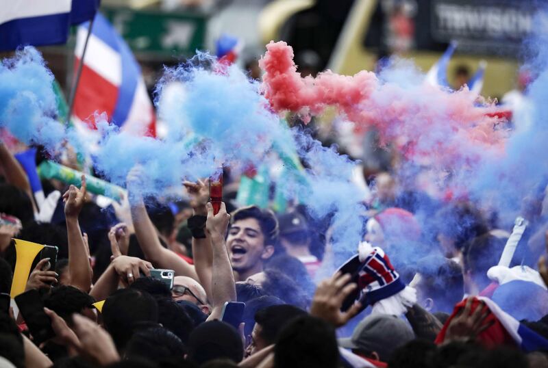 Costa Rican fans celebrate in San Jose. EPA