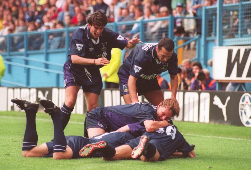 SHEFFIELD, UNITED KINGDOM - AUGUST 20, 1994:  Jurgen Klinsmann of Tottenham is mobbed by teammates after scoring a goal during the FA Carling Premier League match between Sheffield Wednesday and Tottenham Hotspur at Hillsborough on August 20, 1994 in Sheffield, England.  (Photo by Shaun Botterill /Getty Images) 