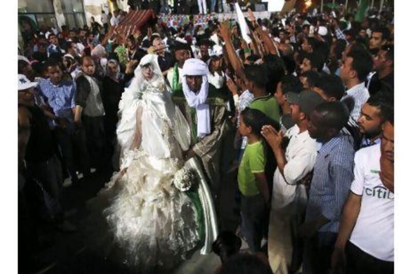 Love and marriage in a war zone, in Tripoli. A reader expresses amazement that people can persist in normal human emotions despite all the travails of disruption and war. Tara Todras-Whitehill / AP