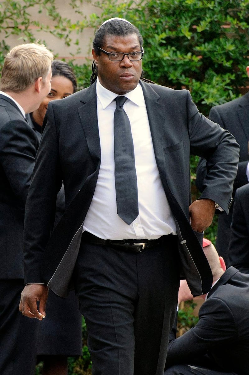 Manager Raye Cosbert arrives at Southgate progressive Synagogue for the funeral ceremony of British singer Amy Winehouse, London, Tuesday, July 26, 2011. Winehouse, who had battled alcohol and drug addiction, was found dead Saturday at her London home. She was 27. (AP Photo/Jonathan Short) *** Local Caption ***  Britain Amy Winehouse Funeral.JPEG-0825e.jpg