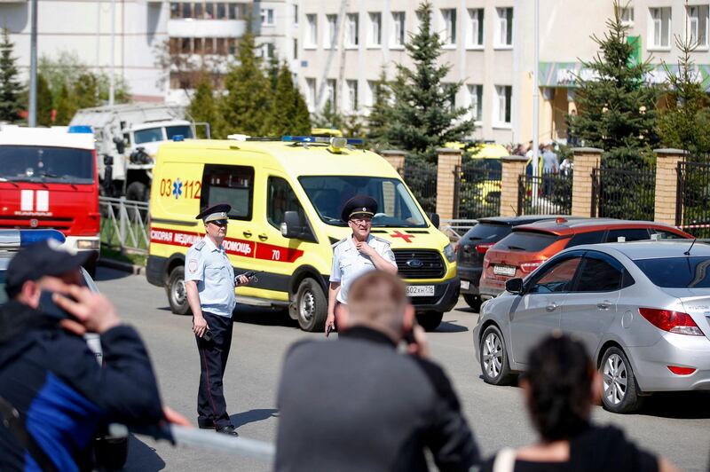 Law enforcement officers and ambulances are seen at the scene of a shooting at School No. 175 in Kazan. AFP