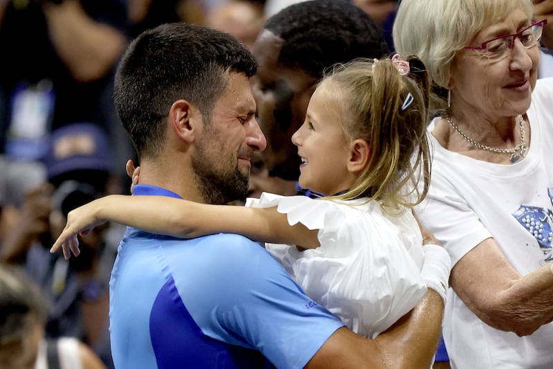 An emotional Novak Djokovic celebrates with daughter Tara after winning the US Open. AFP