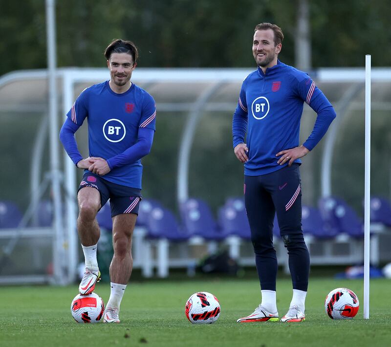 ENFIELD, ENGLAND - OCTOBER 10: Jack Grealish and Harry Kane look on during a training session at Tottenham Hotspur Training Centre on October 10, 2021 in Enfield, England. (Photo by Eddie Keogh - The FA/The FA via Getty Images)