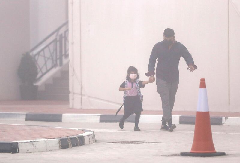 Abu Dhabi, United Arab Emirates, February 14, 2021. Pupils return to Abu Dhabi's private schools. GEMS United Indian School – Abu Dhabi.  A few students arrive in spite of the foggy conditions.
Victor Besa/The National
Section: NA
Reporter:  Anam Rizvi