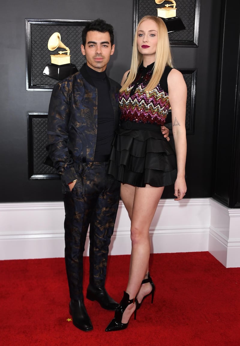 British actress Sophie Turner wears Louis Vuitton as she and her husband US singer Joe Jonas arrives for the 62nd Annual Grammy Awards on January 26, 2020, in Los Angeles.  AFP