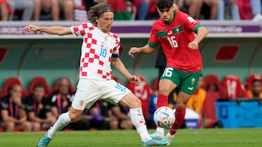 Croatia's Luka Modric (10) and Morocco's Abde Ezzalzouli (16) compete for possession during the World Cup group F soccer match between Morocco and Croatia, at the Al Bayt Stadium in Al Khor , Qatar, Wednesday, Nov.  23, 2022.  (AP Photo / Themba Hadebe)