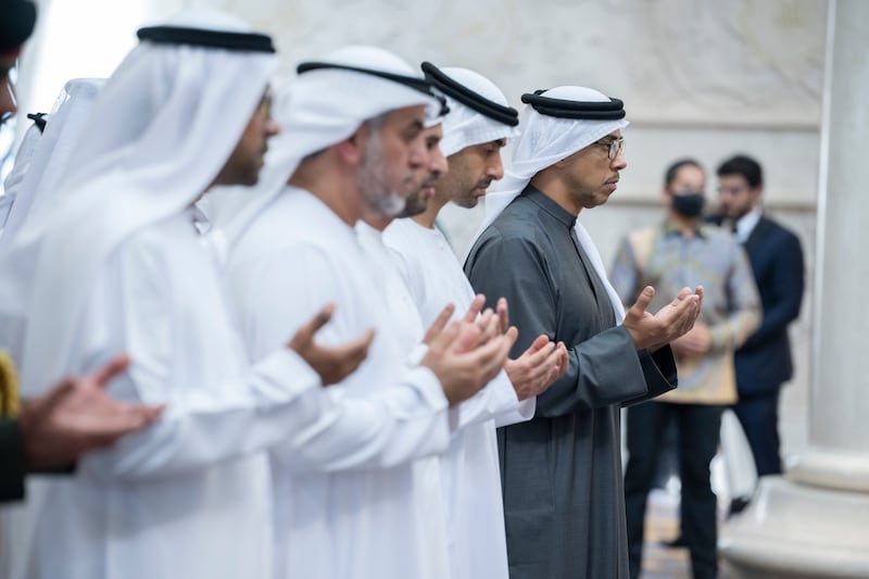 Sheikh Mansour bin Zayed and Sheikh Hamdan bin Mohamed pray during the inauguration of the Sheikh Zayed Grand Mosque. 