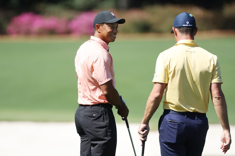 Tiger Woods chats with Billy Horschel in the practice area at Augusta National Golf Club. AFP