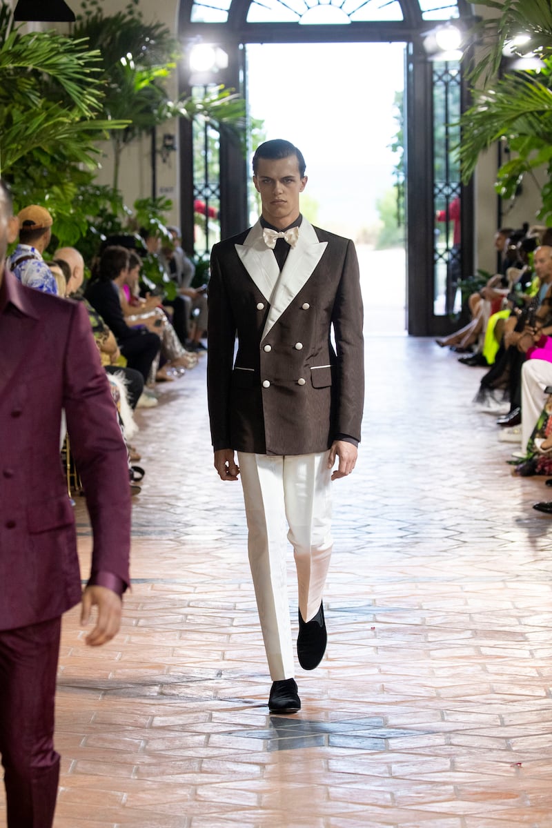 A crisply tailored 1930s-inspired suit in chocolate and cream taffeta