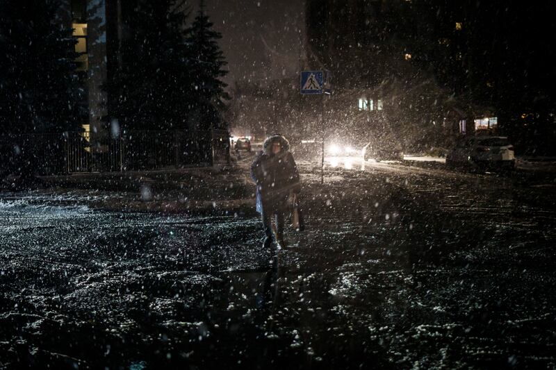 Snowfall and power outages continue in Kyiv and other Ukrainian cities. AP