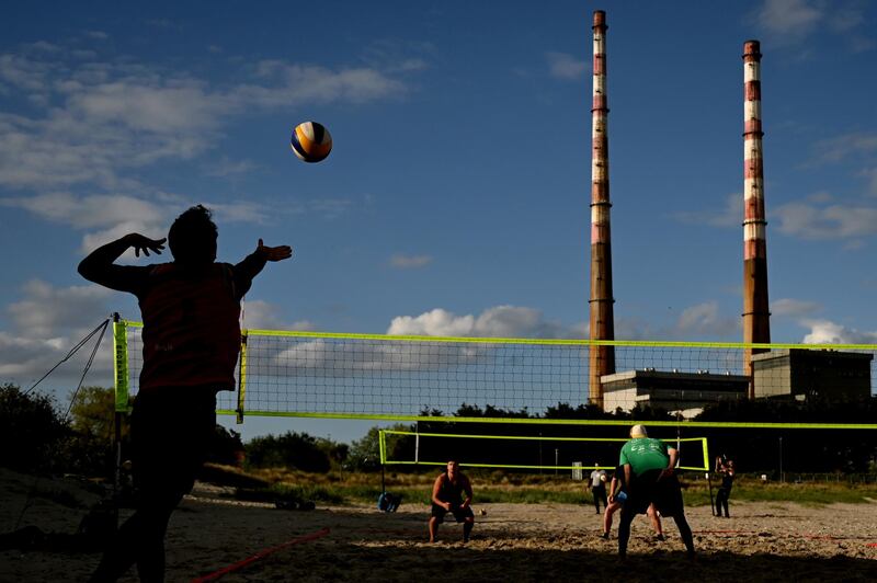 A volleyball game on Poolbeg Beach in Dublin, Ireland, on Thursday May 6, 2021. Reuters