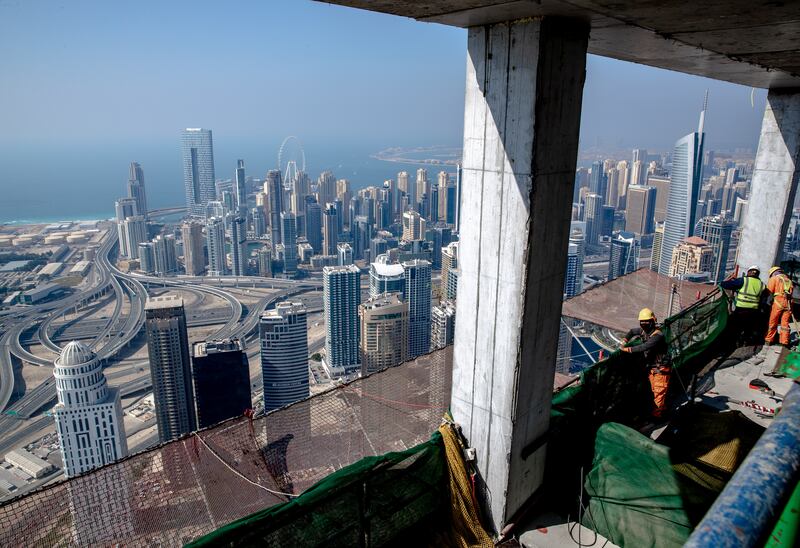 The view over Dubai Marina from the under-construction Uptown Tower. Experts predict the city will see a housing boom as more residential towers and villas are needed. Victor Besa / The National