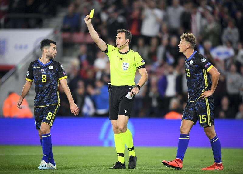 SOUTHAMPTON, ENGLAND - SEPTEMBER 10: Besar Halimi of Kosovo is shown a yellow card from referee, Felix Zwayer  after arguing the penalty decision during the UEFA Euro 2020 qualifier match between England and Kosovo at St. Mary's Stadium on September 10, 2019 in Southampton, England. (Photo by Clive Mason/Getty Images)