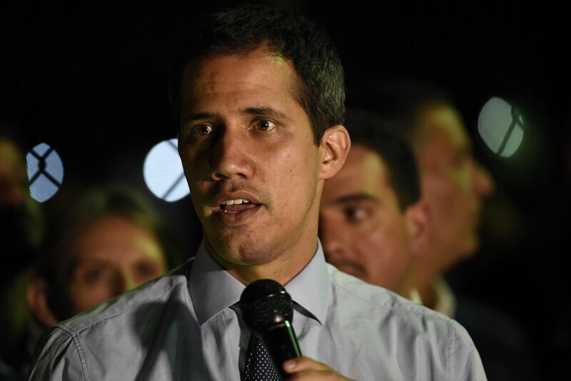 Juan Guaido, president of the National Assembly who swore himself in as the leader of Venezuela, speaks to members of the media outside his home in Caracas, Venezuela, on Tuesday, April 2, 2019. President Nicolas Maduro’s Constituent Assembly, stacked with socialist-party loyalists, stripped opposition leader Guaido of his immunity from prosecution Tuesday, as the government ratchets up pressure against the congressman seeking to oust the country's ruling autocrat. Photographer: Carlos Becerra/Bloomberg