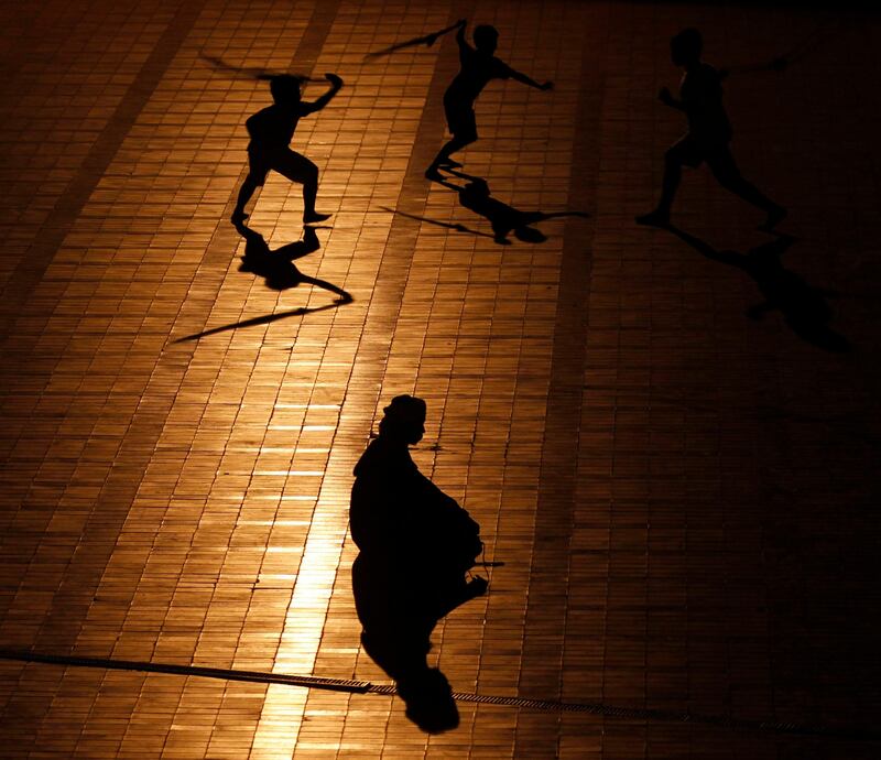 Children play next a man praying before mass prayer session "Tarawih", which marks the beginning of the holy fasting month of Ramadan, at Istiqlal mosque in Jakarta July 31, 2011. Muslims around the world abstain from eating, drinking and conducting sexual relations from sunrise to sunset during Ramadan, the holiest month in the Islamic calendar. REUTERS/Supri  (INDONESIA - Tags: RELIGION IMAGES OF THE DAY) *** Local Caption ***  JAK09_INDONESIA_0731_11.JPG