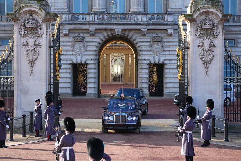 King Charles and the queen consort leaving Buckingham Palace in the royal entourage. Getty Images
