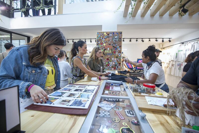 Dubai, United Arab Emirates-  Visitors checking out art design in one of the brand outlet at the Sole Dubai Festival at D3.  Leslie Pableo for The National for Saeed Saeed's story