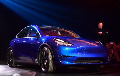 Tesla CEO Elon Musk views the new Tesla Model Y at its unveiling in Hawthorne, California on March 14, 2019.  / AFP / Frederic J. BROWN
