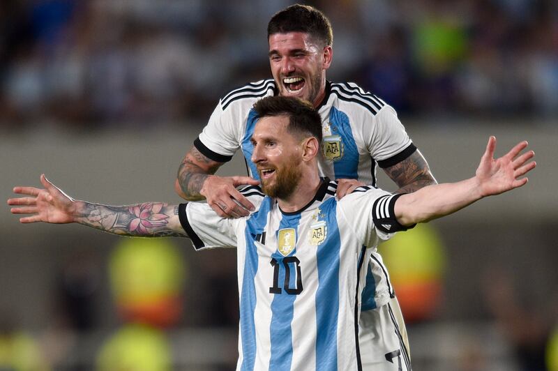 Argentina's Lionel Messi celebrates with teammate Rodrigo De Paul after scoring his side's second goal against Panama. It was his 800th goal in his senior career. AFP