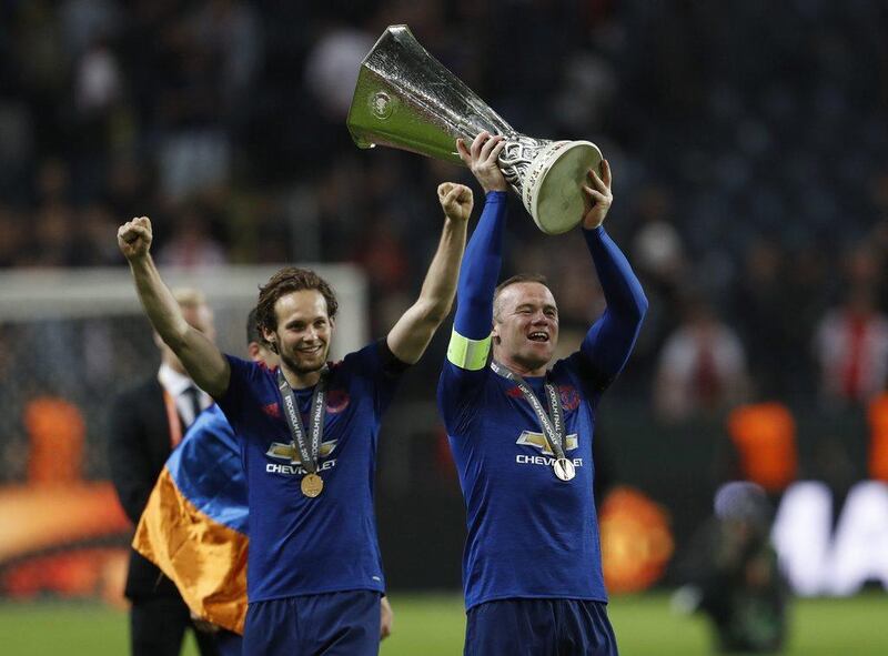Wayne Rooney parades the Europa League trophy around the Friends Arena after Manchester United’s final victory over Ajax. Reuters