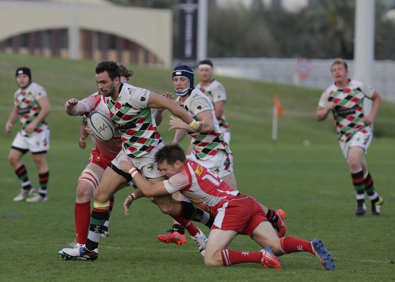 Luke Andrew Stevenson (No 10 of Abu Dhabi Harlequins)  is caught by Bahrain’s defence  in a West Asia Championship match held at the Zayed Sports City on March 18.  Jeffrey E Biteng / The National