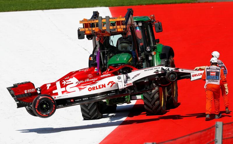 Kimi Raikkonen's Alfa Romeo is removed from the track.