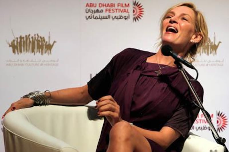 US actress Uma Thurman laughs during a press briefing on the sidelines of the Abu Dhabi International Film Festival ahead of the festival's closing ceremony in the Emirati capital on October 22, 2010. AFP PHOTO/STR

