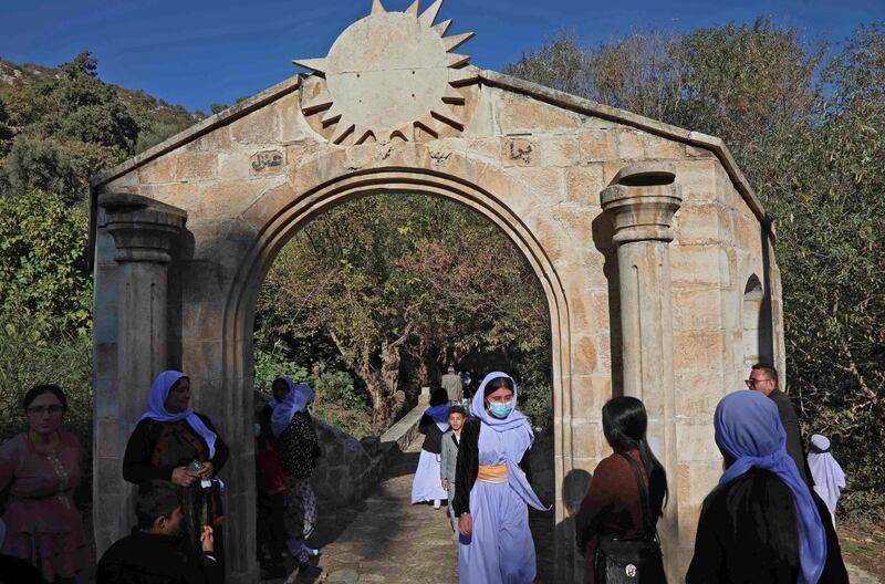 Iraqi Yazidi women visit the Lalish temple situated in a valley near Dohuk, 430 kilometres (260 miles) northwest of the Iraqi capital.  AFP