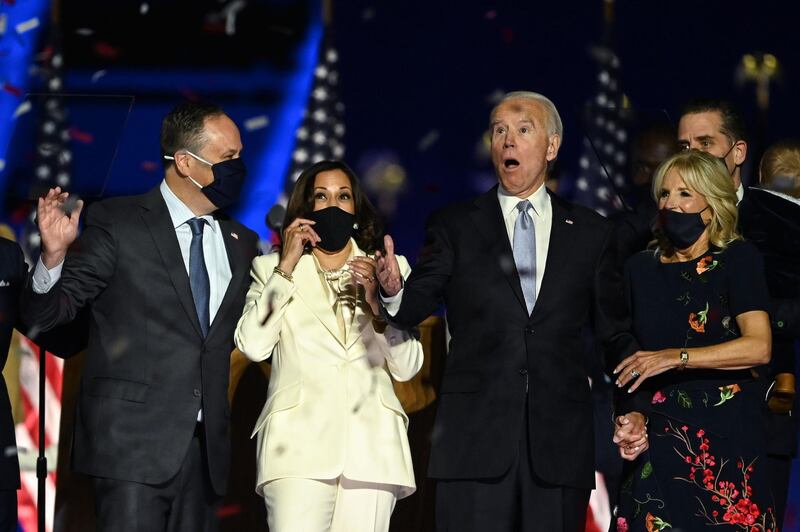 US President-elect Joe Biden and Vice President-elect Kamala Harris react as confetti falls, with Jill Biden and Douglas Emhoff, after delivering remarks in Wilmington, Delaware.  AFP