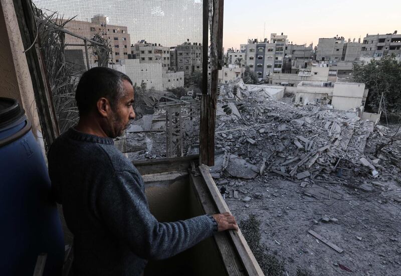 A man looks at the rubble of a building in Gaza City. AFP Photo