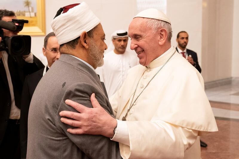ABU DHABI, UNITED ARAB EMIRATES - February 3, 2019: Day one of the UAE Papal visit -  His Holiness Pope Francis, Head of the Catholic Church (R) greets His Eminence Dr Ahmad Al Tayyeb, Grand Imam of the Al Azhar Al Sharif (L), at the Presidential Airport. 

( Ryan Carter / Ministry of Presidential Affairs )
---